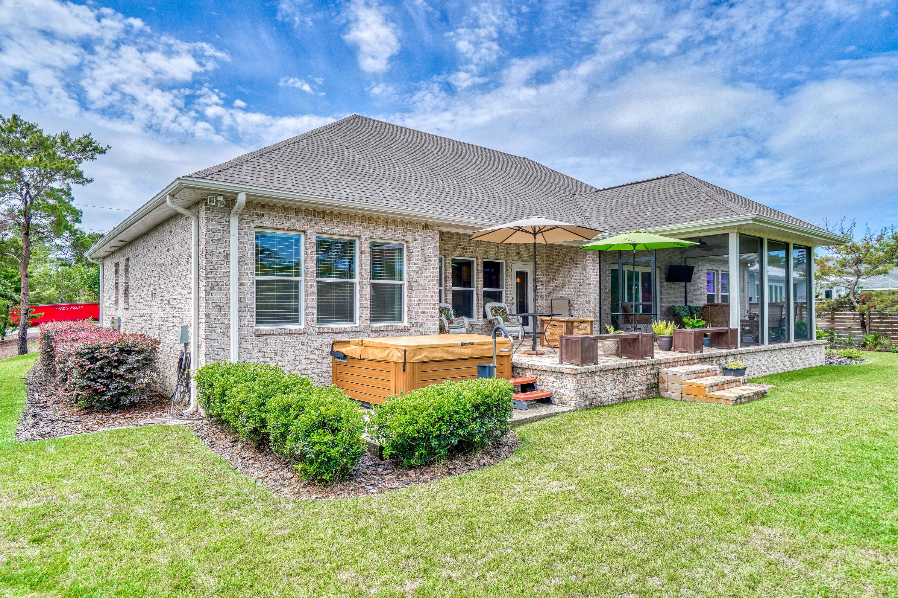 488 Ridge Road Santa Rosa Beach, FL 32459 - Photo 41 of 46 a front view of a house with porch and garden