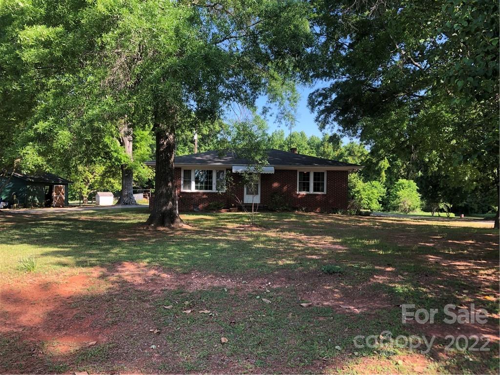 4839 Tabernacle Road Lancaster, SC 29720 - Photo 1 of 23 a front view of a house with a garden