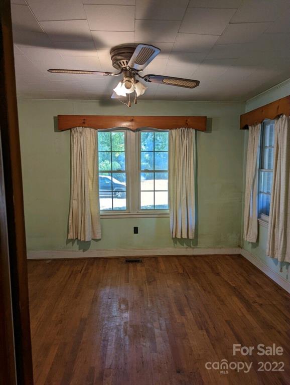 4839 Tabernacle Road Lancaster, SC 29720 - Photo 16 of 23 a view of an empty room with wooden floor and fan