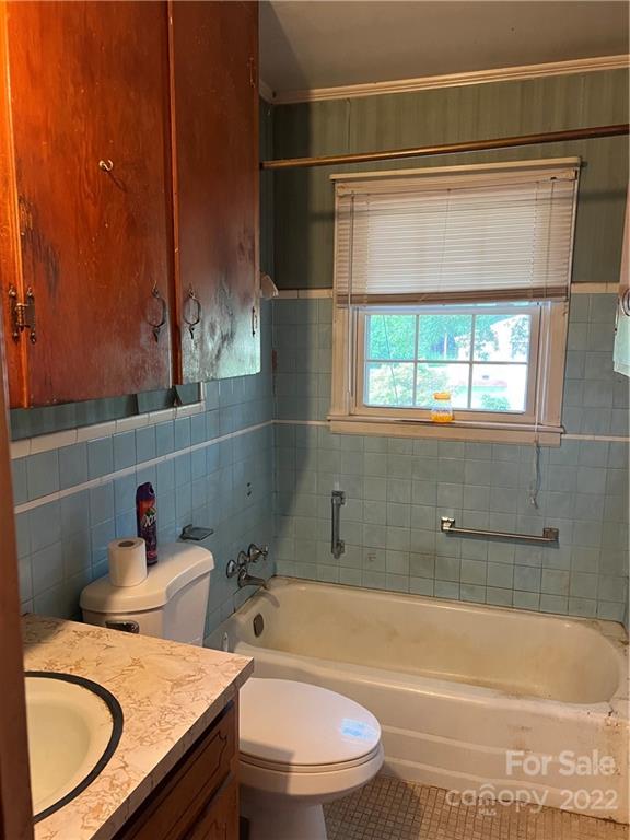 4839 Tabernacle Road Lancaster, SC 29720 - Photo 18 of 23 a bathroom with a granite countertop toilet sink and mirror
