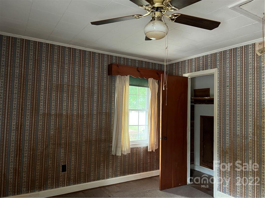 4839 Tabernacle Road Lancaster, SC 29720 - Photo 19 of 23 a view of a interior space with a large window and chandelier fan