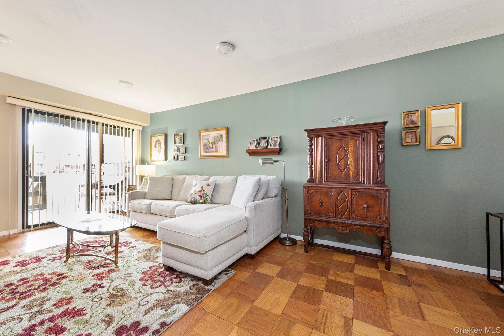 248 Mariners Way Copiague, NY 11726 - Photo 6 of 18 a living room with furniture and a rug