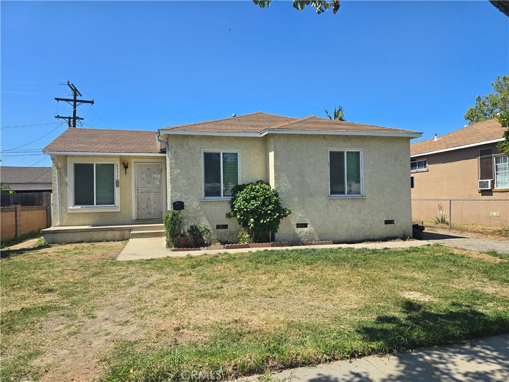9542 Rex Road Pico Rivera, CA 90660 - Photo 1 of 11 a front view of a house with a yard