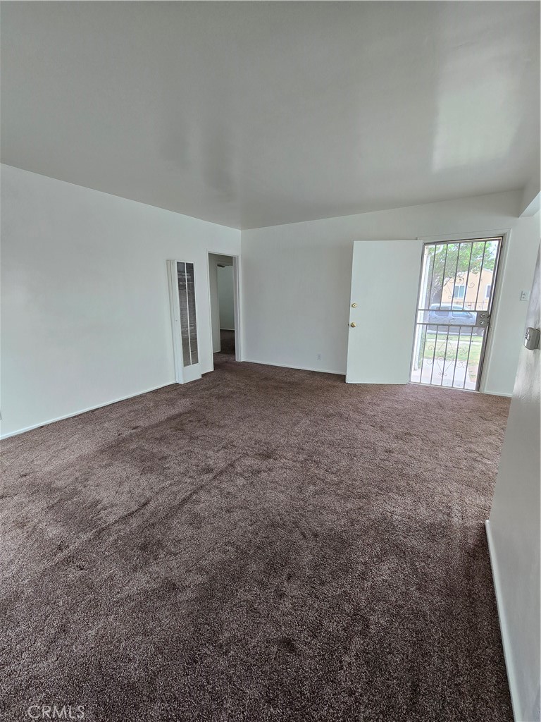 9542 Rex Road Pico Rivera, CA 90660 - Photo 2 of 11 an empty room with windows