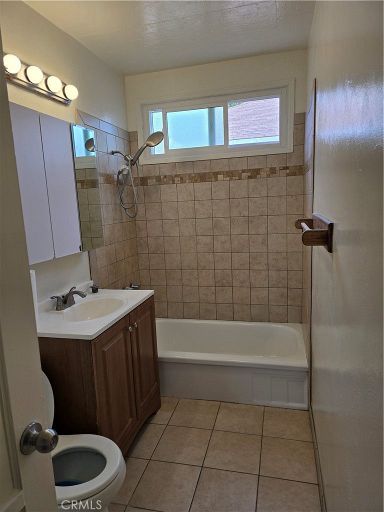 9542 Rex Road Pico Rivera, CA 90660 - Photo 5 of 11 a bathroom with a sink toilet and shower