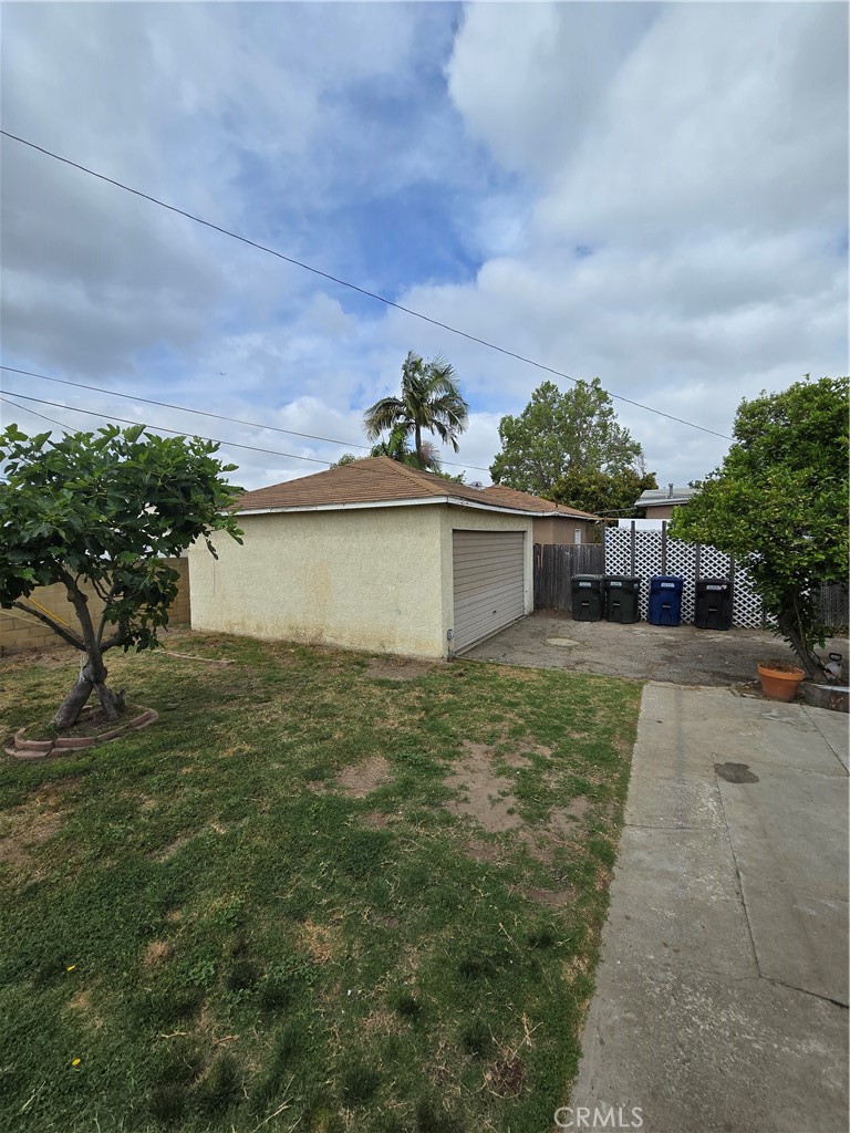 9542 Rex Road Pico Rivera, CA 90660 - Photo 10 of 11 a front view of a house with a yard and potted plants