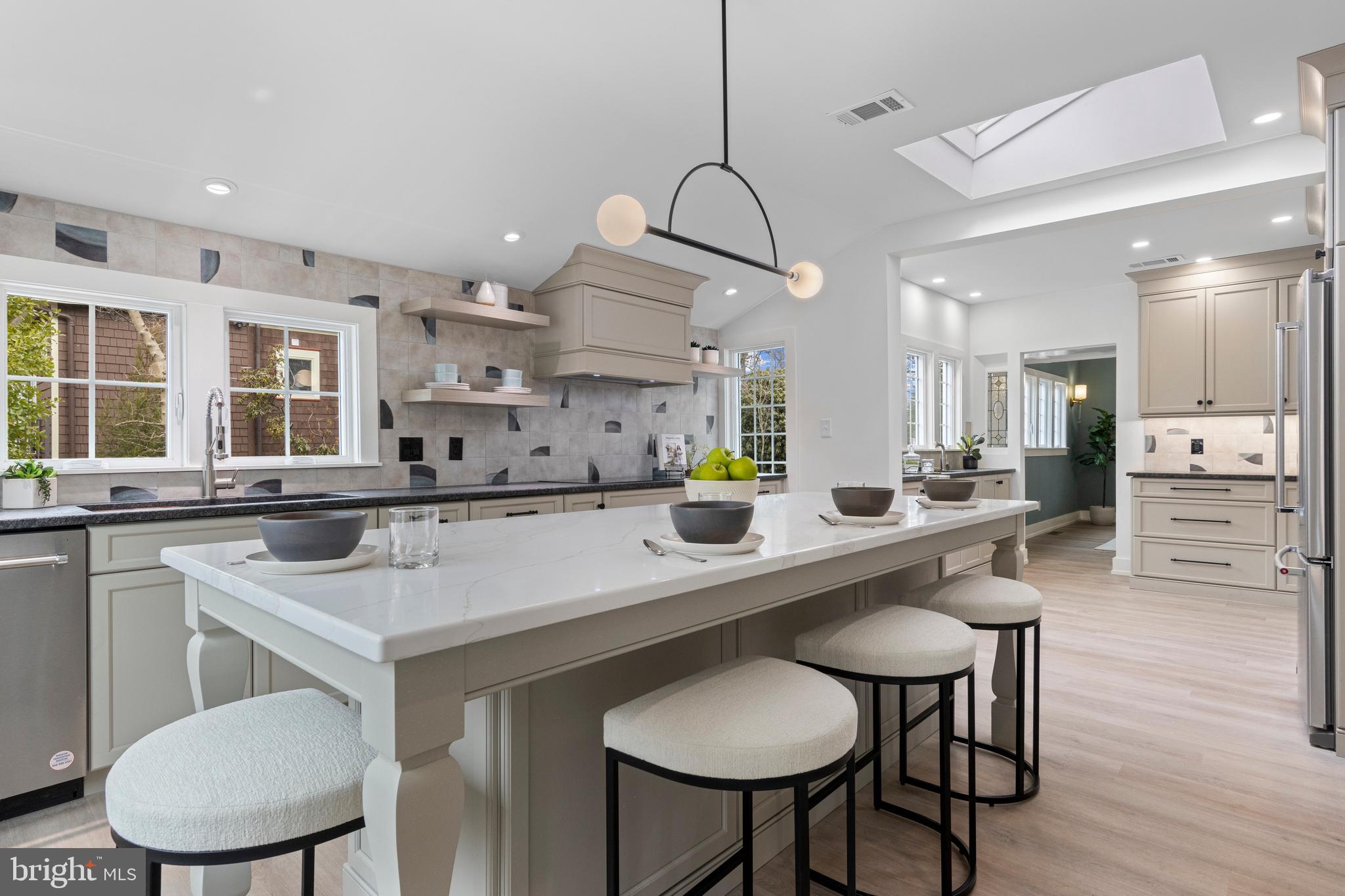 222 Rutgers Avenue Swarthmore, PA 19081 - Photo 12 of 40 a kitchen with stainless steel appliances kitchen island a table and chairs in it