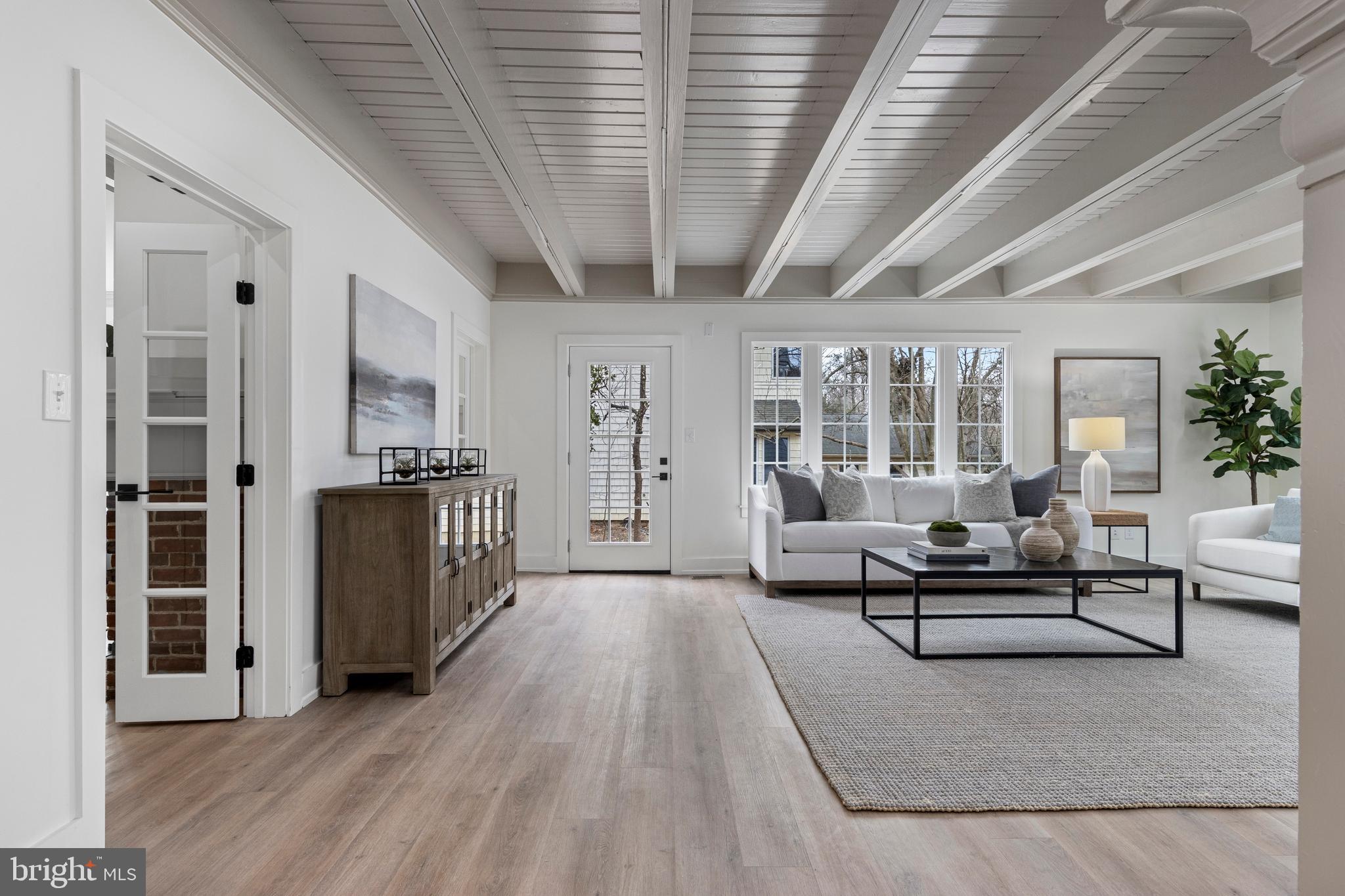 222 Rutgers Avenue Swarthmore, PA 19081 - Photo 16 of 40 a living room with furniture and a chandelier