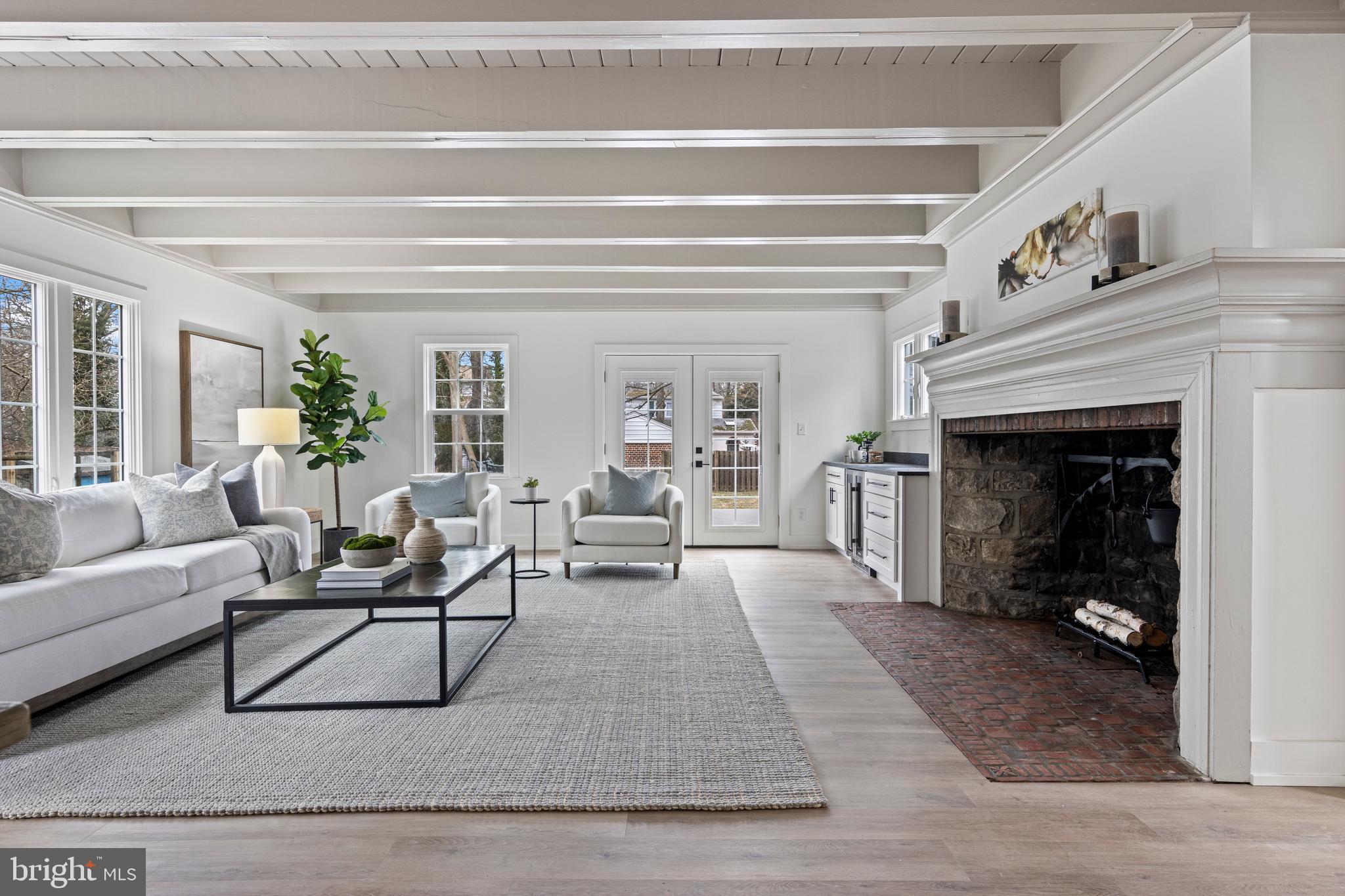 222 Rutgers Avenue Swarthmore, PA 19081 - Photo 17 of 40 a living room with furniture and a fireplace