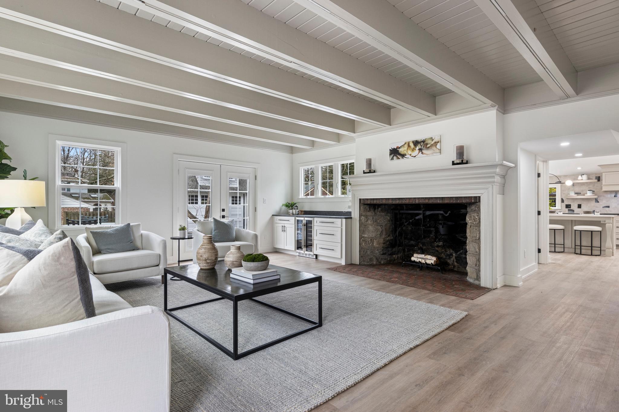 222 Rutgers Avenue Swarthmore, PA 19081 - Photo 18 of 40 a living room with furniture and a fireplace