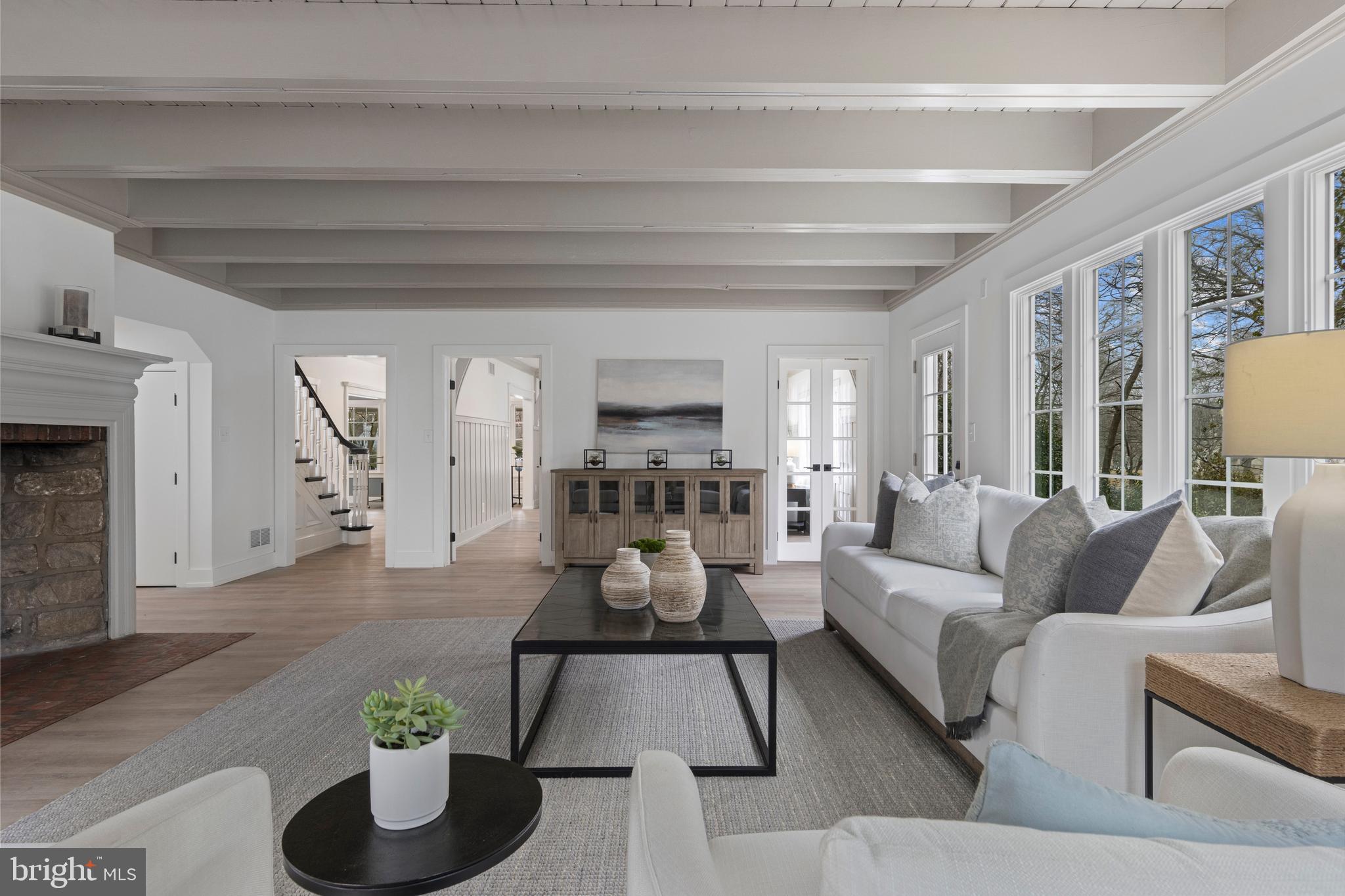 222 Rutgers Avenue Swarthmore, PA 19081 - Photo 19 of 40 a living room with furniture and a fireplace