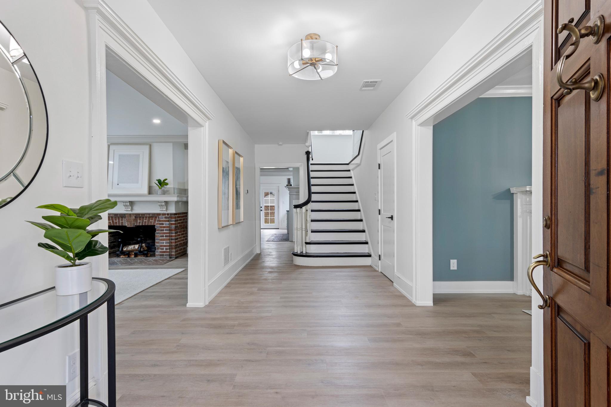 222 Rutgers Avenue Swarthmore, PA 19081 - Photo 2 of 40 a view of an entryway with wooden floor and a chandelier