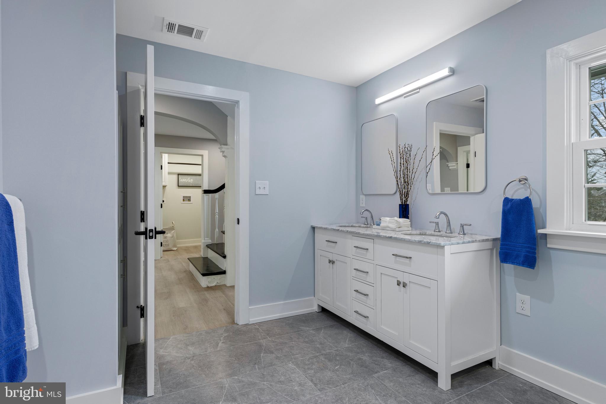 222 Rutgers Avenue Swarthmore, PA 19081 - Photo 22 of 40 a bathroom with a double vanity sink and mirror