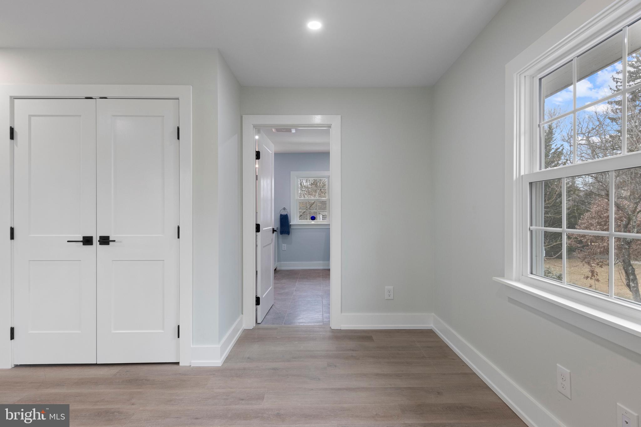 222 Rutgers Avenue Swarthmore, PA 19081 - Photo 23 of 40 a view of a hallway with wooden floor and a cabinet