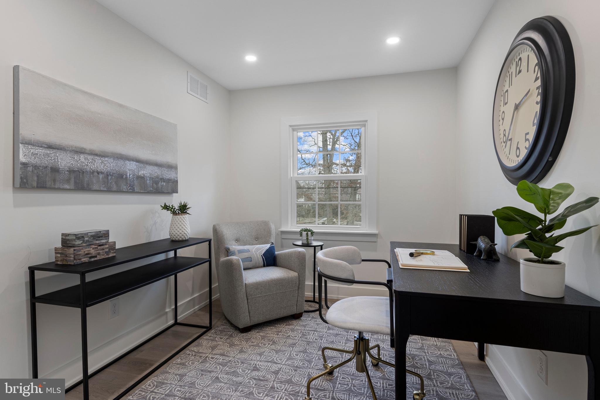 222 Rutgers Avenue Swarthmore, PA 19081 - Photo 25 of 40 a living room with furniture a window and a potted plant