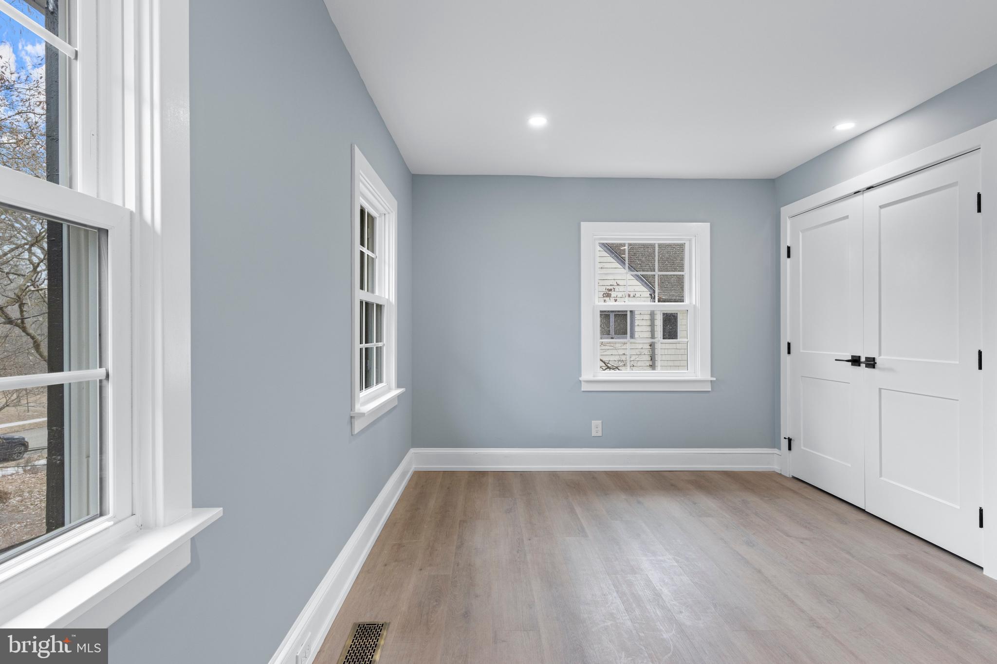222 Rutgers Avenue Swarthmore, PA 19081 - Photo 26 of 40 a view of empty room with wooden floor and fan