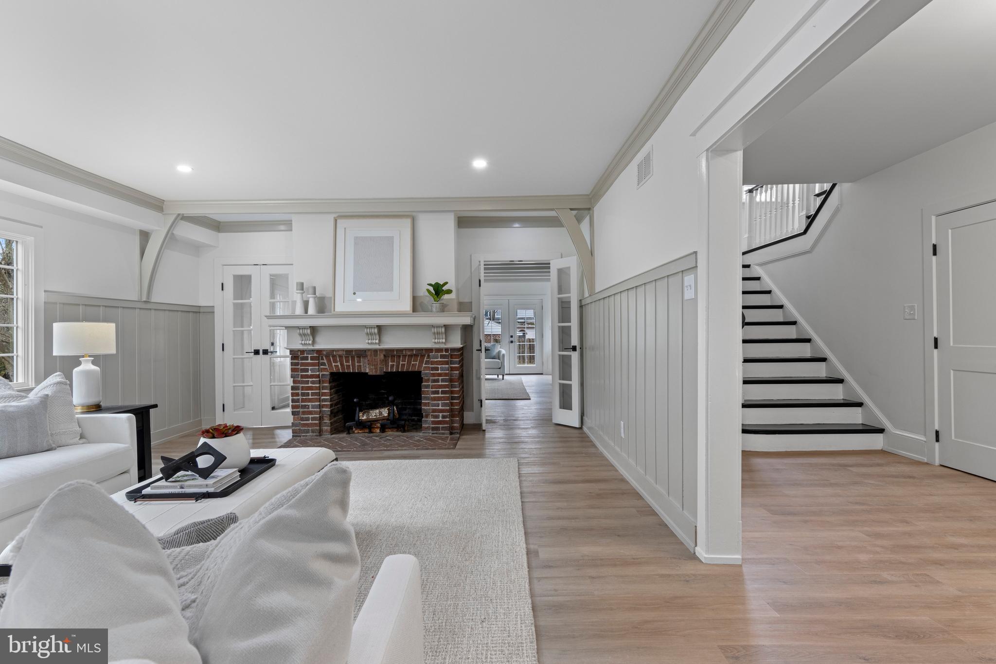 222 Rutgers Avenue Swarthmore, PA 19081 - Photo 3 of 40 a living room with furniture and a fireplace