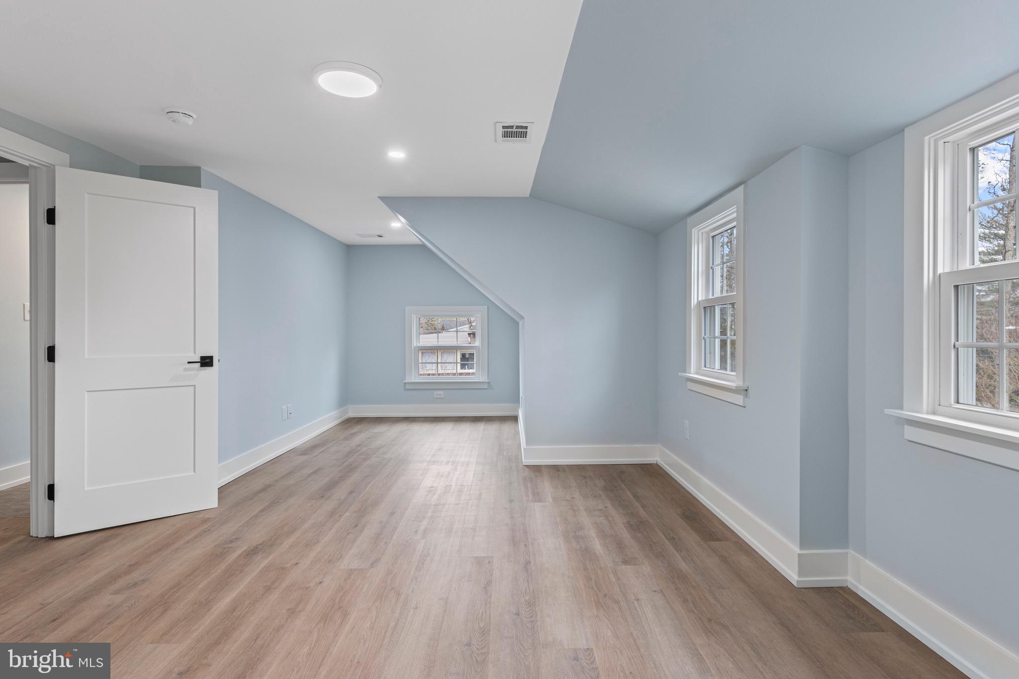 222 Rutgers Avenue Swarthmore, PA 19081 - Photo 33 of 40 an empty room with wooden floor and windows