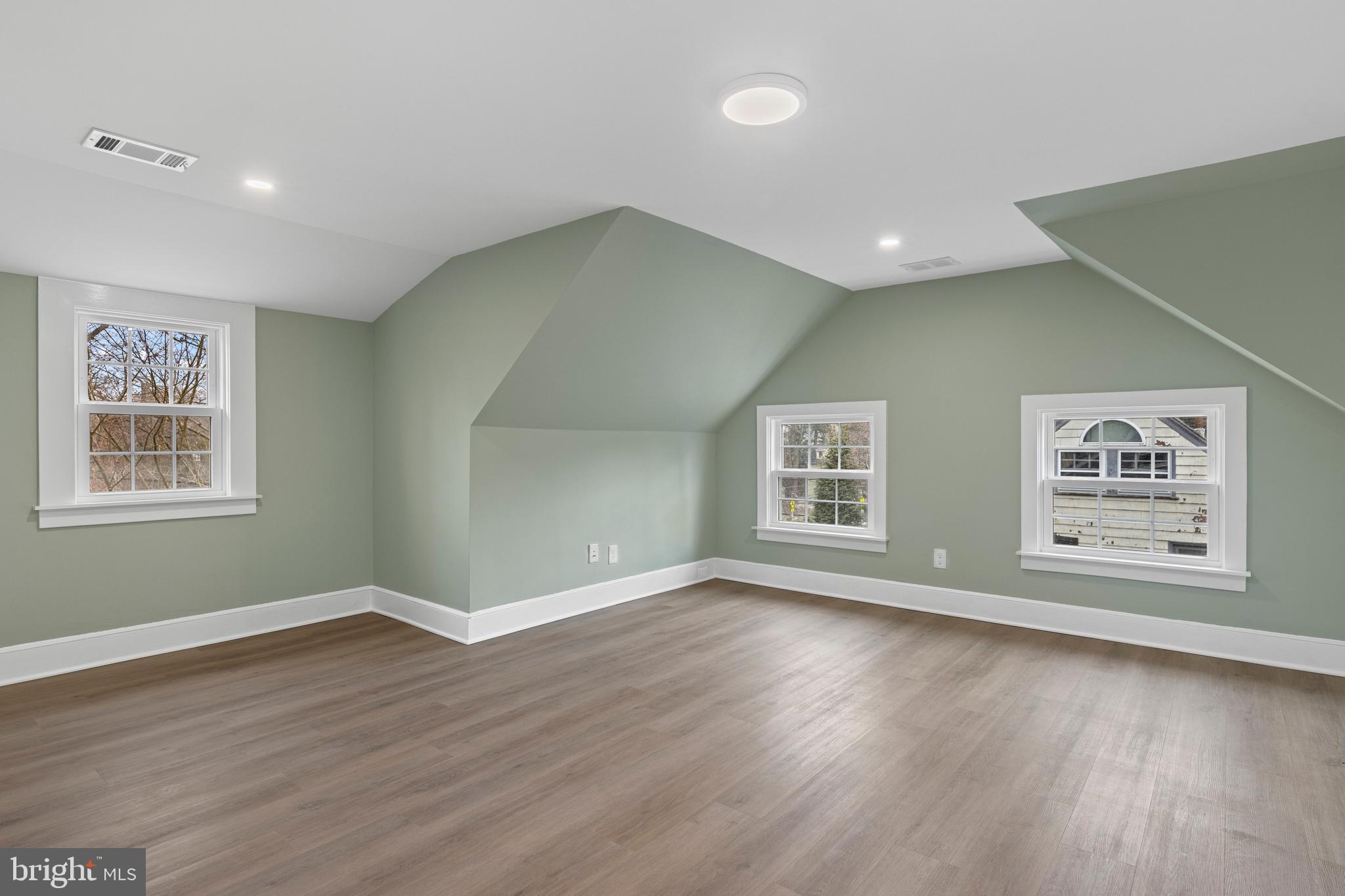 222 Rutgers Avenue Swarthmore, PA 19081 - Photo 35 of 40 a view of an empty room with wooden floor and a window