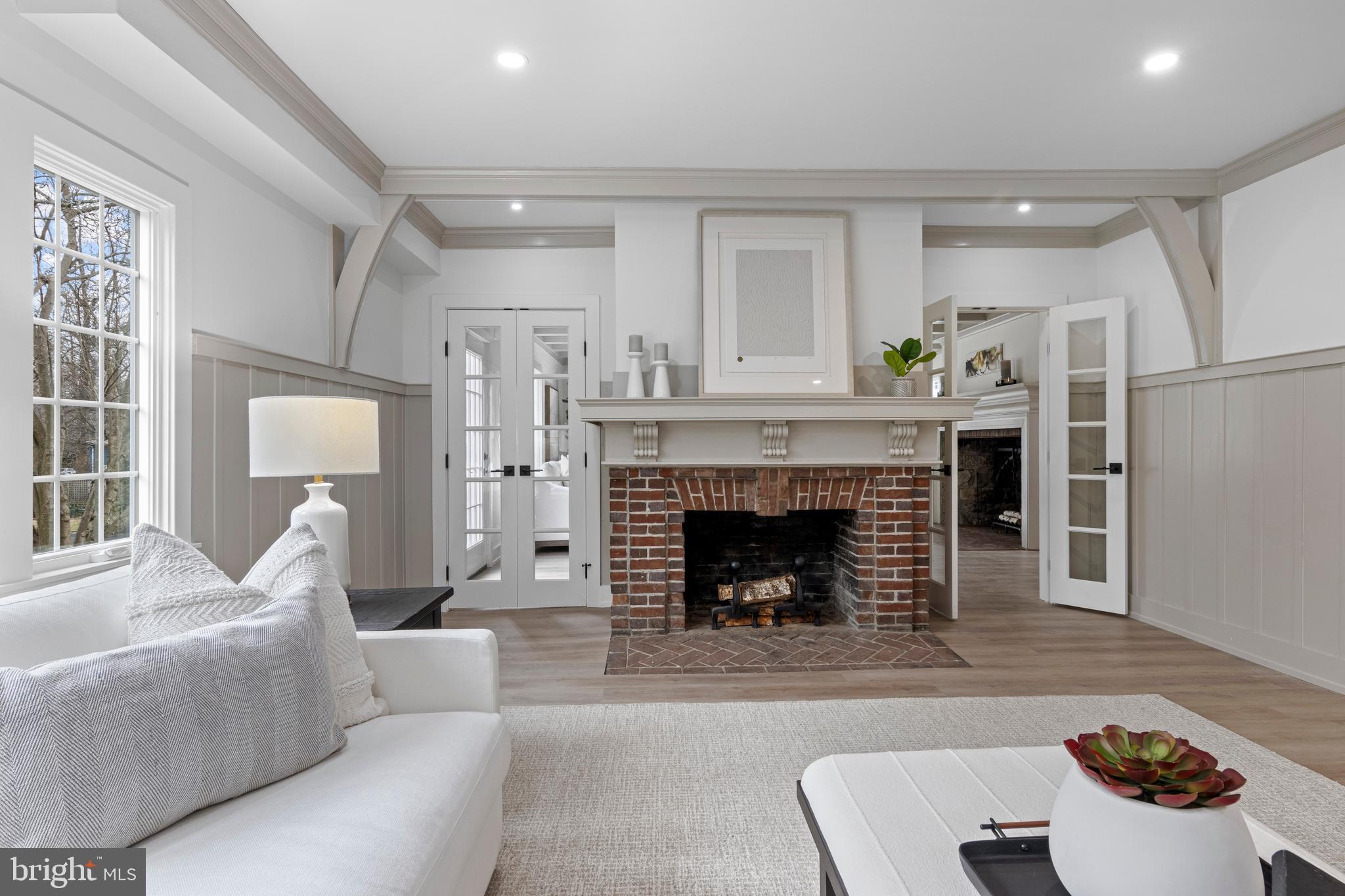 222 Rutgers Avenue Swarthmore, PA 19081 - Photo 6 of 40 a living room with furniture and a fireplace