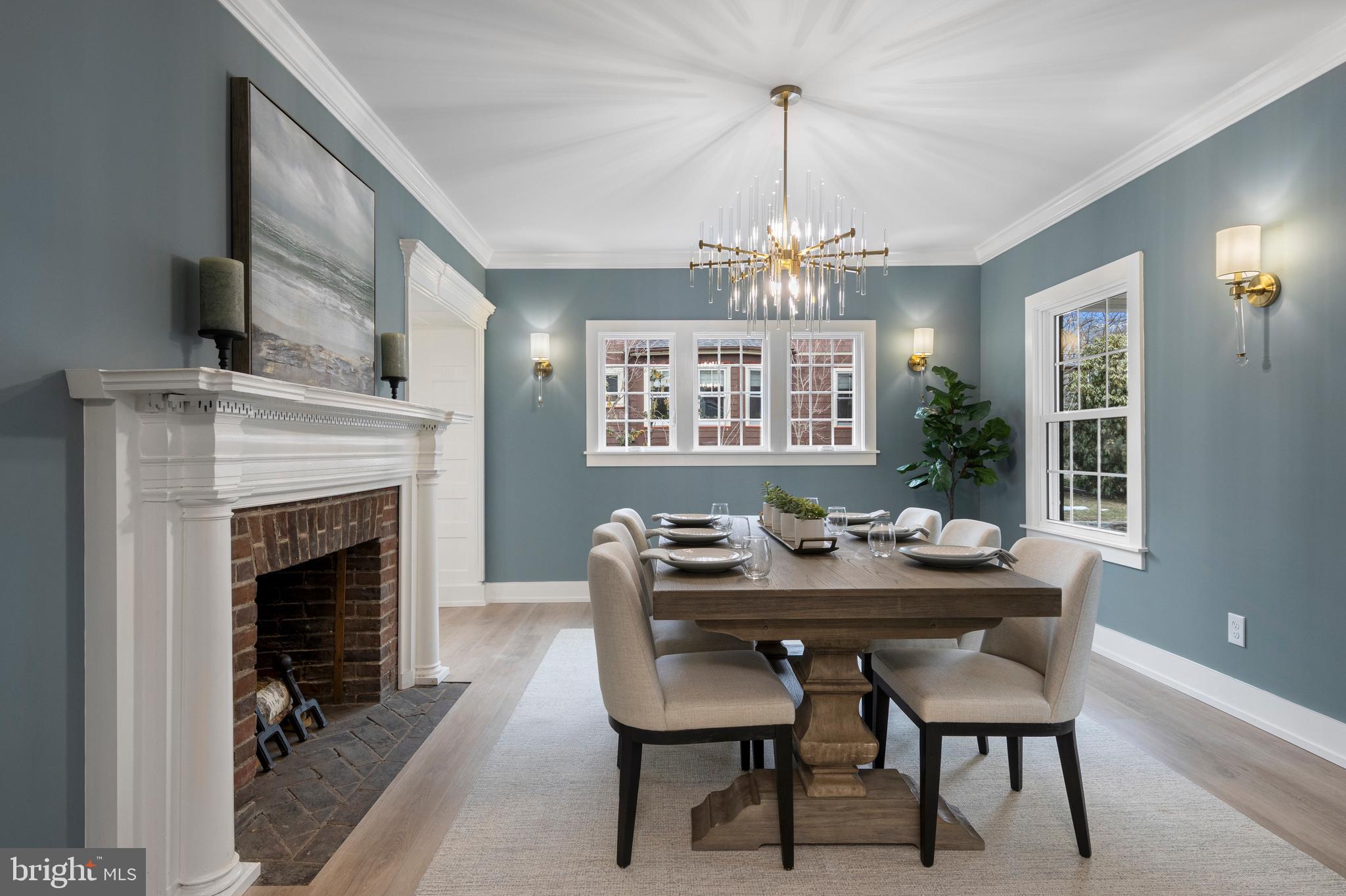 222 Rutgers Avenue Swarthmore, PA 19081 - Photo 9 of 40 a dining room with furniture a chandelier and wooden floor