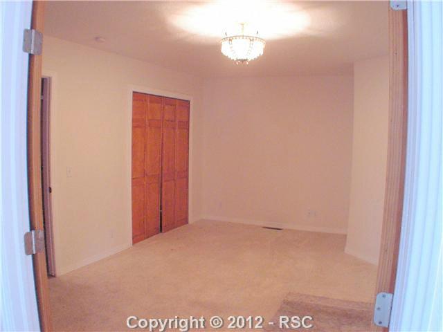 8211 Inca Road Larkspur, CO 80118 - Photo 11 of 24 Bedroom 4 also adjoins the master bedroom, which could also double as a nursery, an office, or a master retreat!