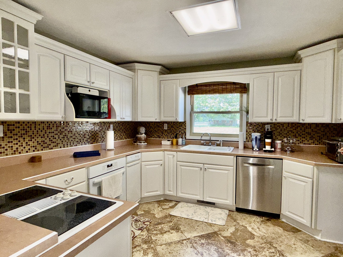 956 Country Club Road Metropolis, IL 62960 - Photo 11 of 48 a kitchen with granite countertop white cabinets and white appliances
