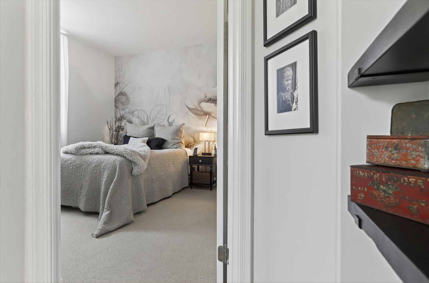 410 5th Street Northeast, Unit 1 Washington, DC 20002 - Photo 12 of 37 Serene primary bedroom with artistic flair.