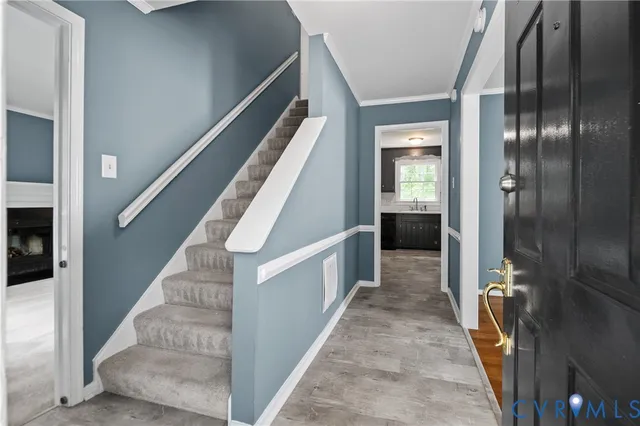 a view of a hallway view with staircase