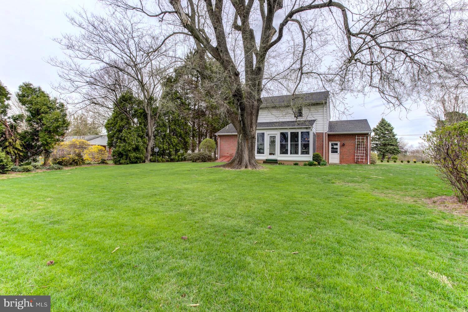 104 Cedar Street Chestertown, MD 21620 - Photo 2 of 16 a house view with a sitting space and garden