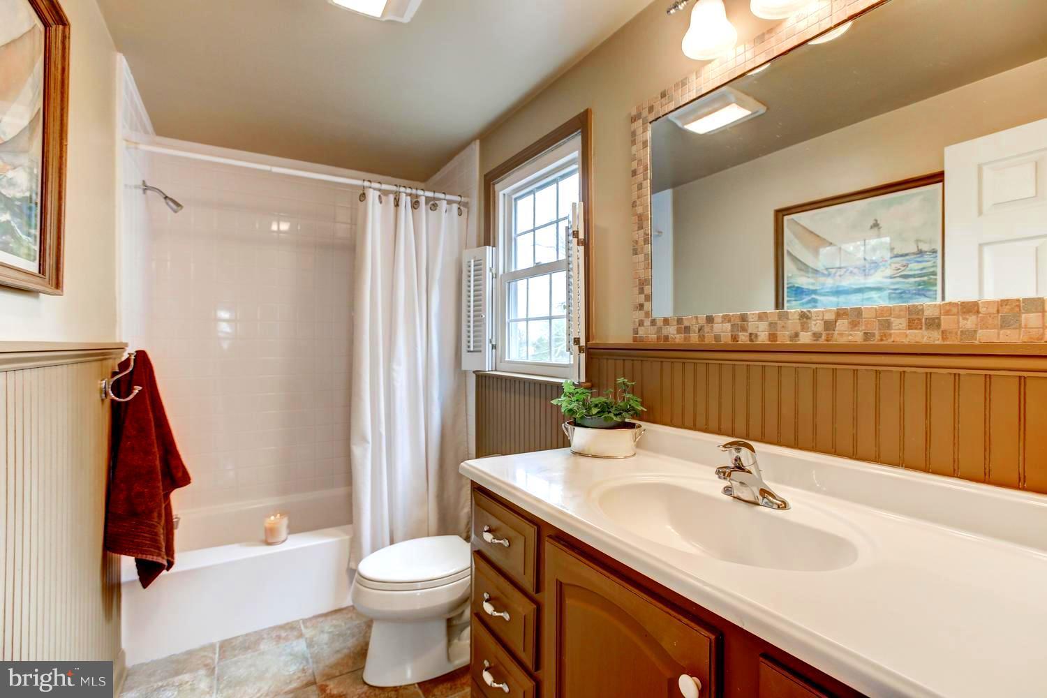 104 Cedar Street Chestertown, MD 21620 - Photo 12 of 16 a bathroom with a sink toilet and shower