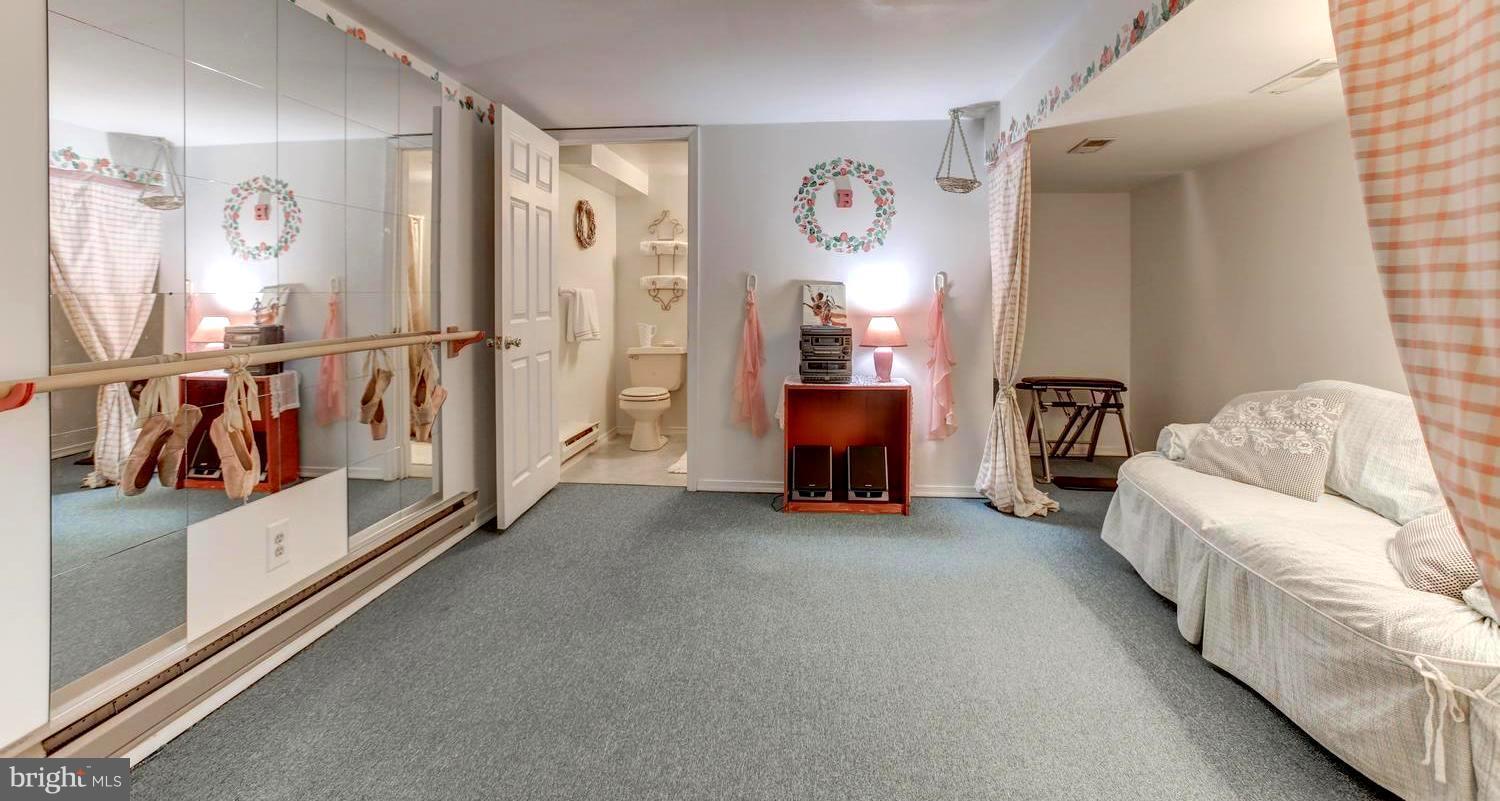 104 Cedar Street Chestertown, MD 21620 - Photo 15 of 16 a living room with furniture and a flat screen tv