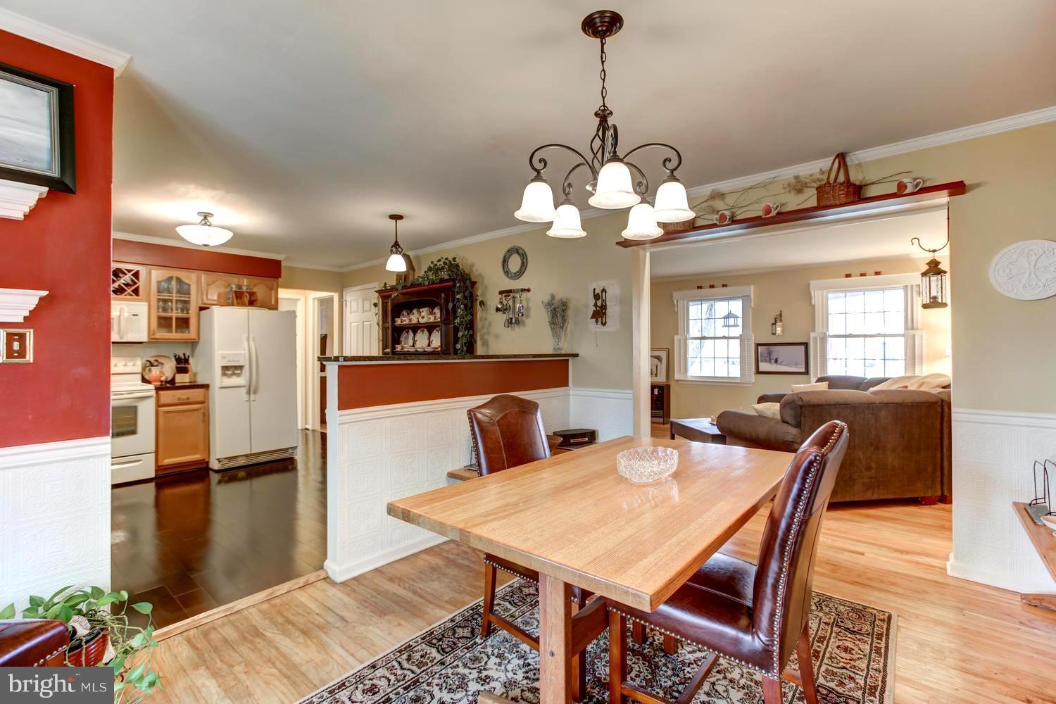104 Cedar Street Chestertown, MD 21620 - Photo 5 of 16 a view of a dining room and a chandelier
