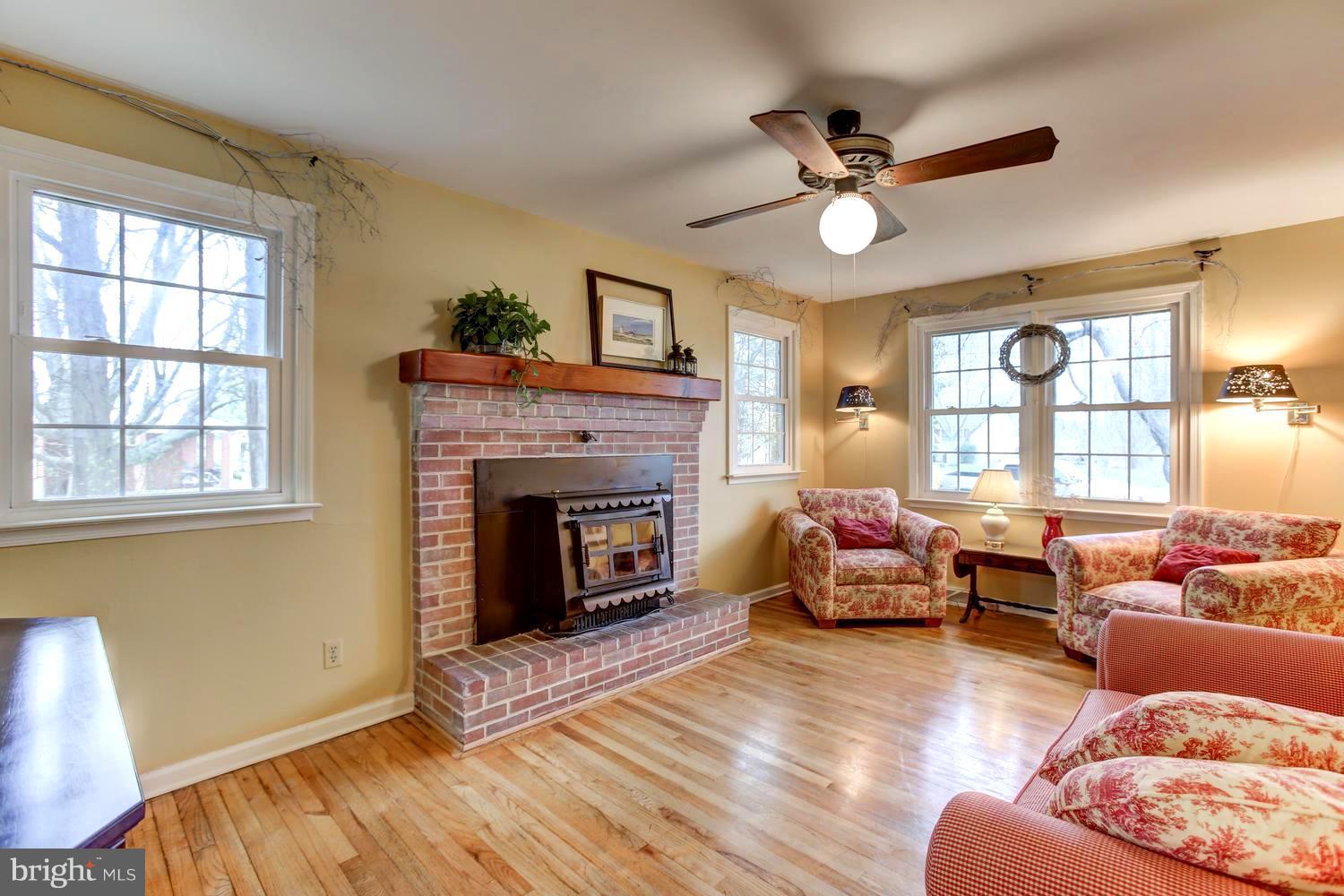 104 Cedar Street Chestertown, MD 21620 - Photo 8 of 16 a living room with furniture and a fireplace