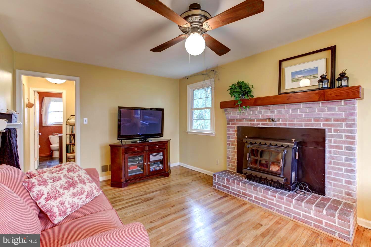 104 Cedar Street Chestertown, MD 21620 - Photo 9 of 16 a living room with furniture and a fireplace