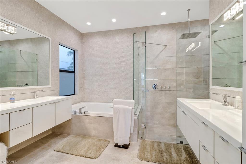 4410 Caldera Circle Naples, FL 34119 - Photo 16 of 35 a bathroom with a sink a toilet and shower