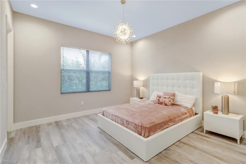 4410 Caldera Circle Naples, FL 34119 - Photo 17 of 35 a bedroom with a bed and a window