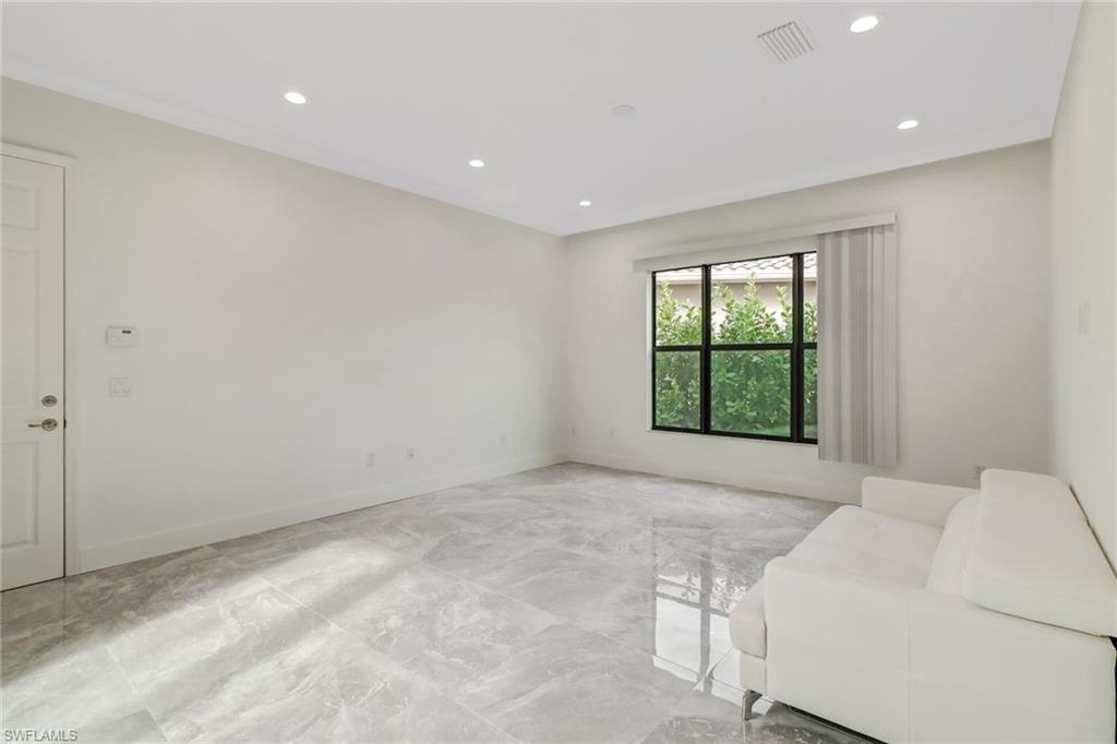 4410 Caldera Circle Naples, FL 34119 - Photo 19 of 35 a view of an empty room with a window