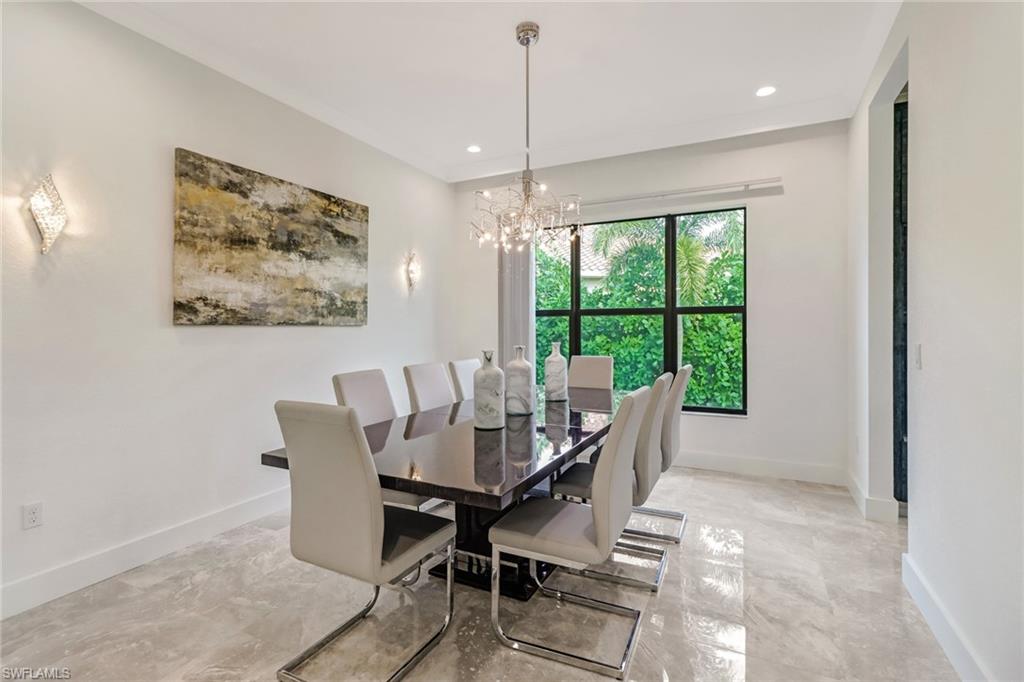 4410 Caldera Circle Naples, FL 34119 - Photo 9 of 35 a view of a dining room with furniture window and outside view