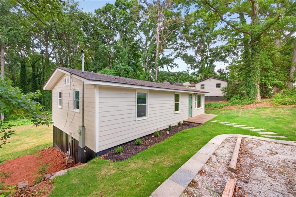 136 Nowell Street Monroe, GA 30655 - Photo 2 of 25 a view of a house with a yard