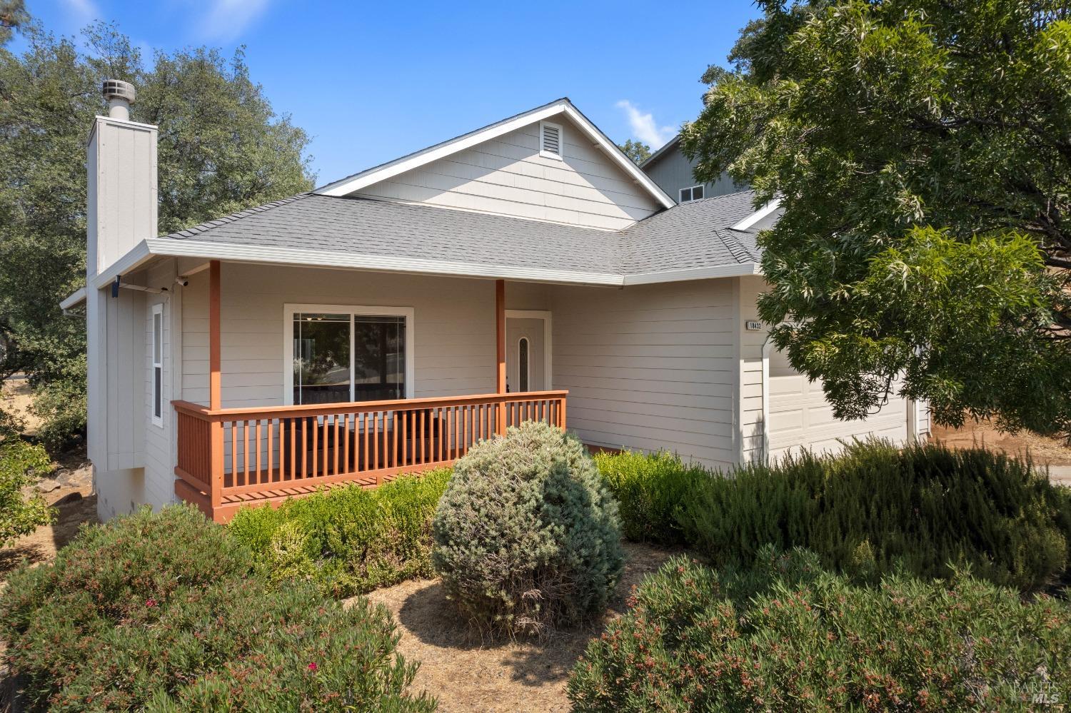 18432 Kentwood Place Hidden Valley Lake, CA 95467 - Photo 1 of 35 a front view of a house with garden