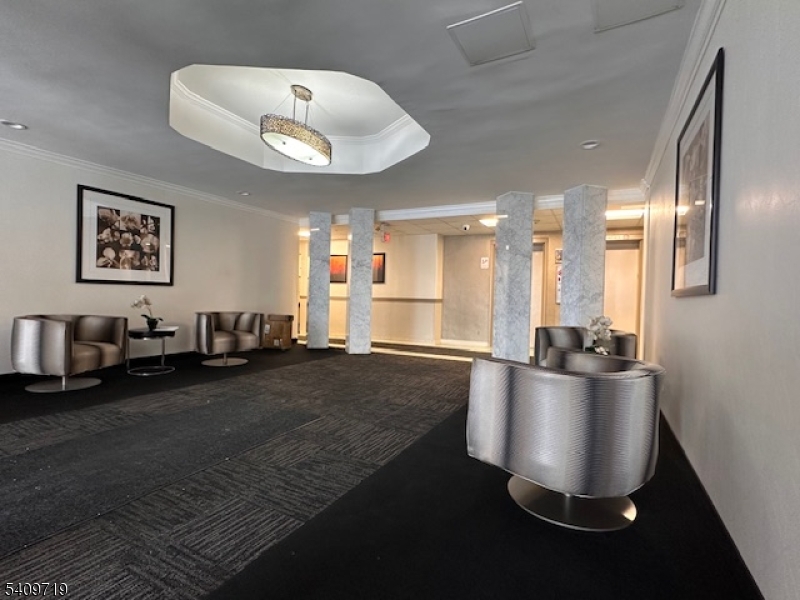 77 Prospect Avenue, Unit D Hackensack, NJ 07601 - Photo 11 of 14 a living room with furniture