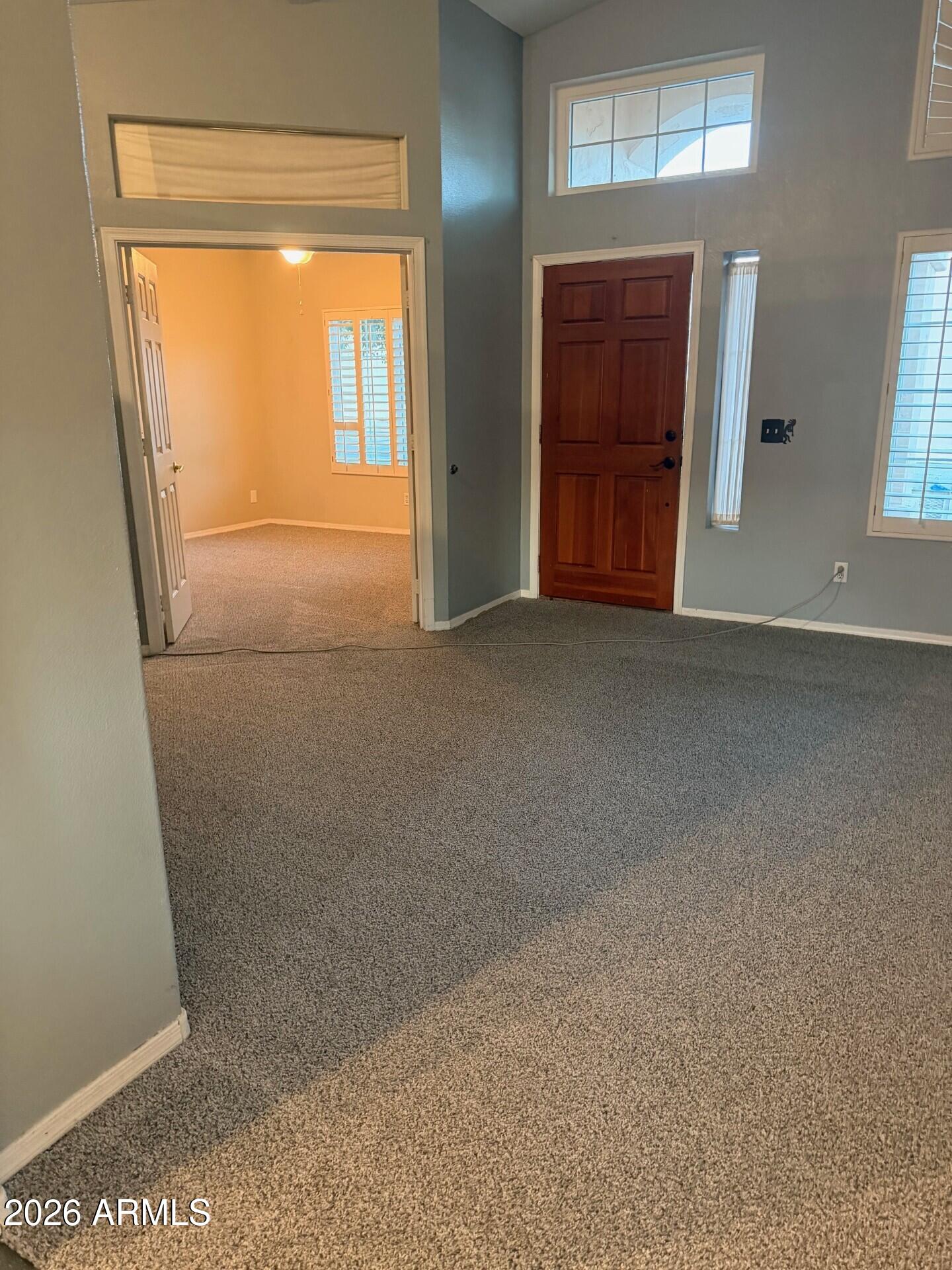 4906 East Brown Road, Unit 14 Mesa, AZ 85205 - Photo 9 of 10 a view of an empty room with a window