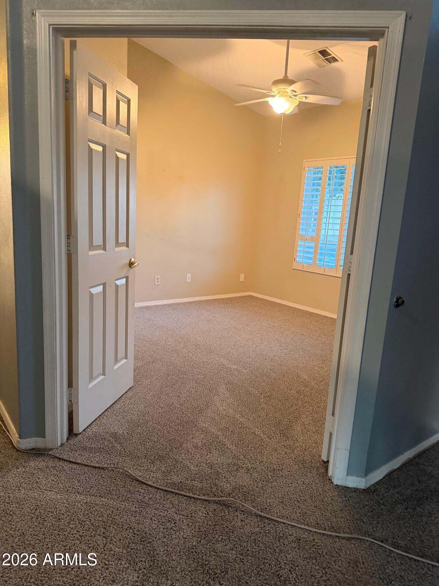 4906 East Brown Road, Unit 14 Mesa, AZ 85205 - Photo 10 of 10 an empty room with windows and closet