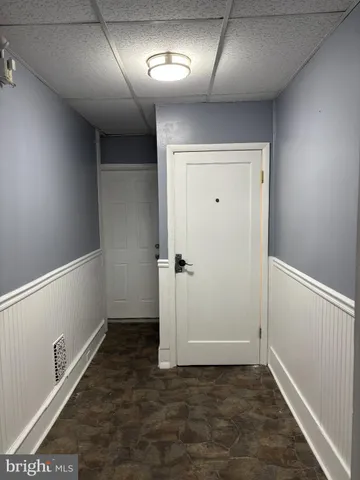 an empty room with wooden floor