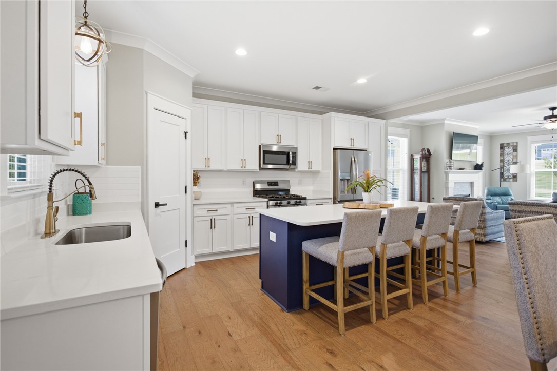 318 Summerall Drive Anderson, SC 29621 - Photo 41 of 42 This kitchen features a bright open floor plan with a central island and a seamless flow into the living area.