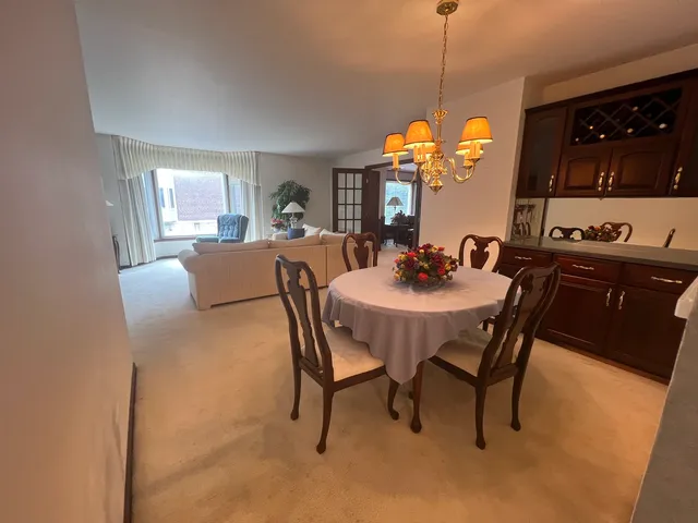 a view of a dining room with furniture and window