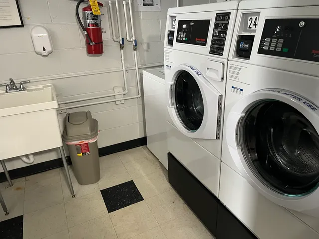 a bathroom with a glass door shower and sink