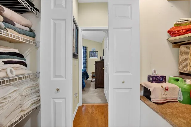 a utility room with closet dryer and washer