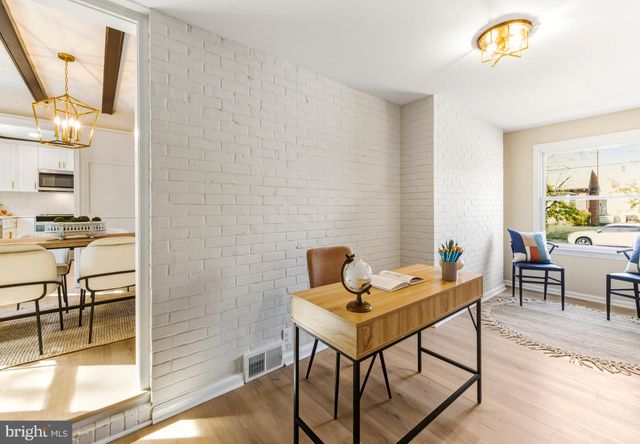 a workspace with furniture and a window